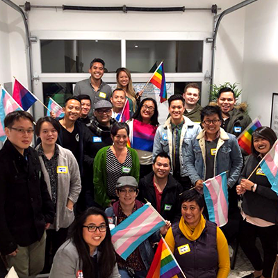 QAPIMEDA Coalition Holding Pride Flags