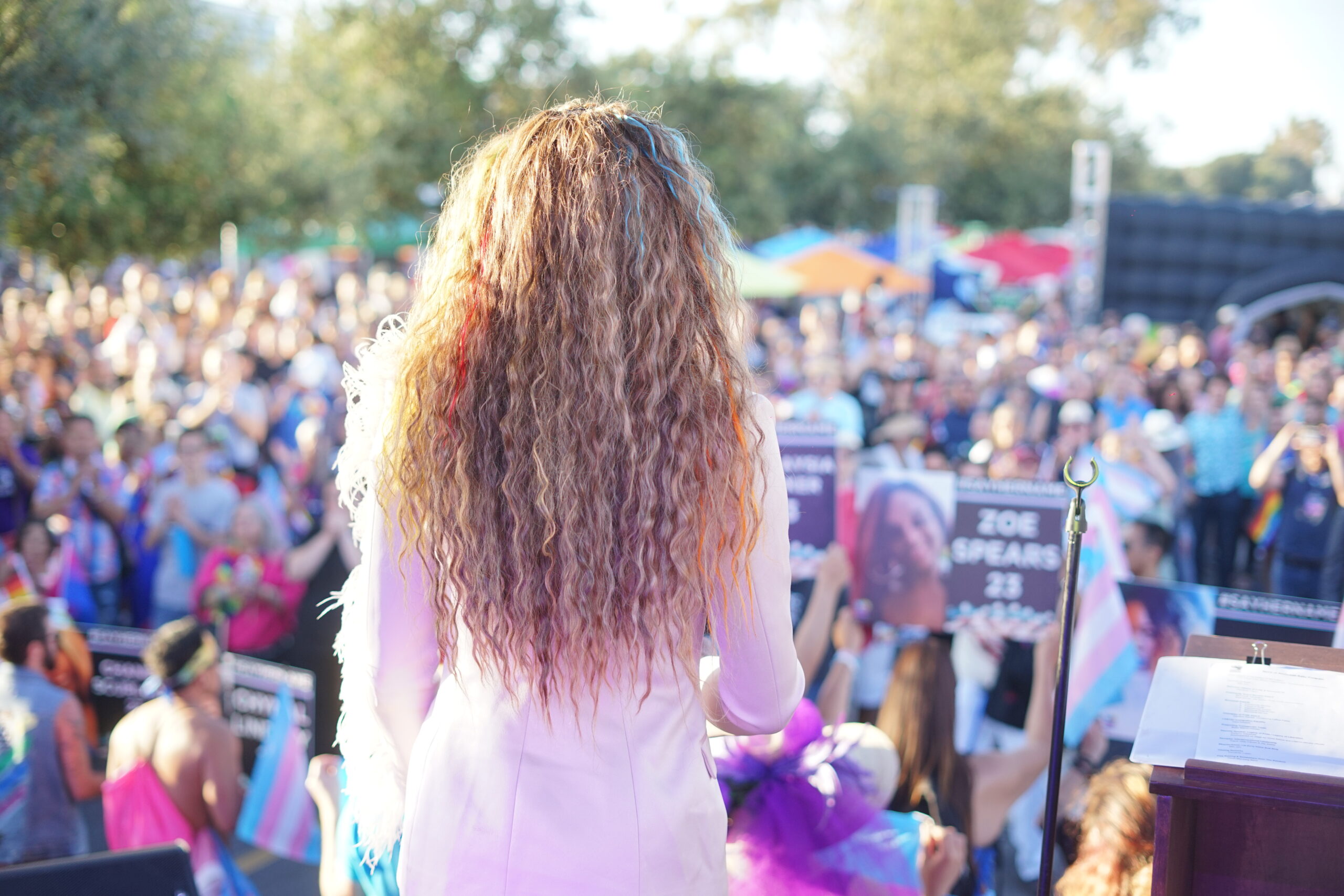 Someone speaking at the Stonewall Rally in front of large crowd