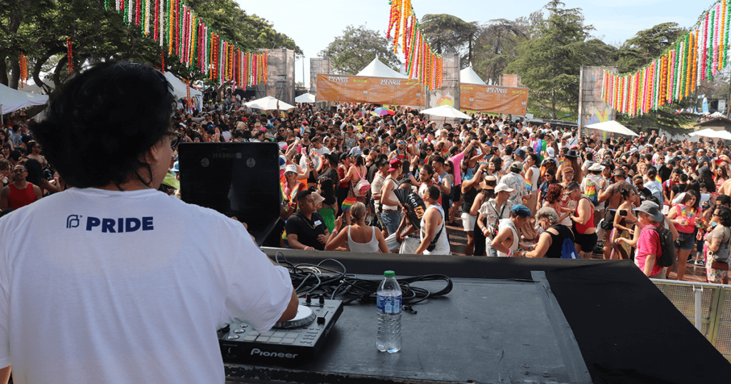 A DJ performing for a full crowd on the Mundo Latino Stage